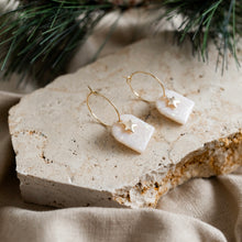 Load image into Gallery viewer, Cute festive hoop earrings with star charms.