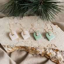 Load image into Gallery viewer, Cute festive hoop earrings with star charms.
