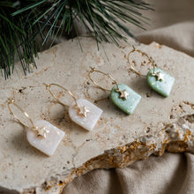 Load image into Gallery viewer, Cute festive hoop earrings with star charms.