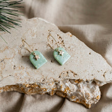 Load image into Gallery viewer, Cute festive hoop earrings with star charms.