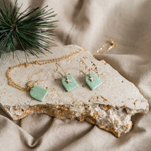 Load image into Gallery viewer, Cute festive hoop earrings with star charms.