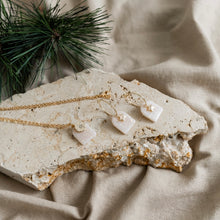 Load image into Gallery viewer, Cute festive hoop earrings with star charms.